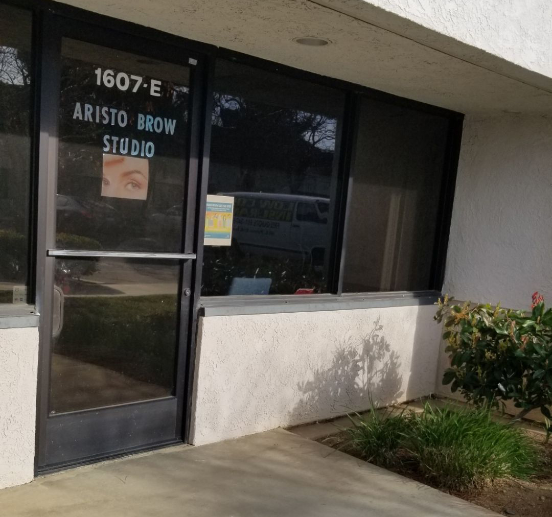 The Aristo Brow Studio front door at 1607-E