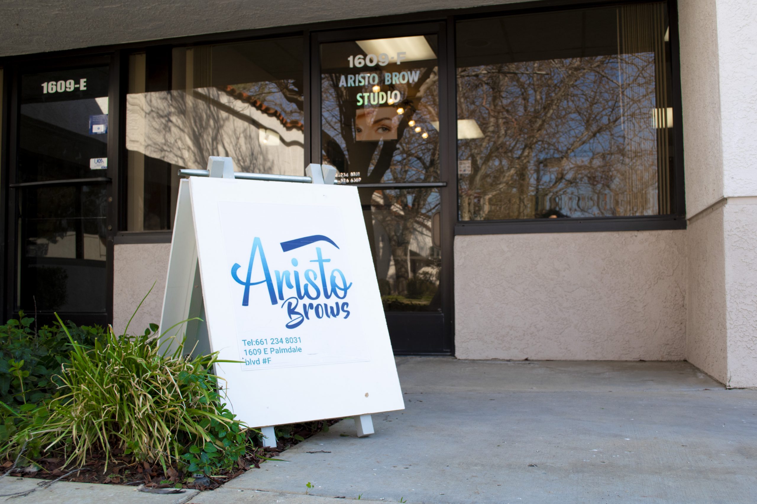 The Aristo Brows sign outside the studio on East Palmdale Boulevard